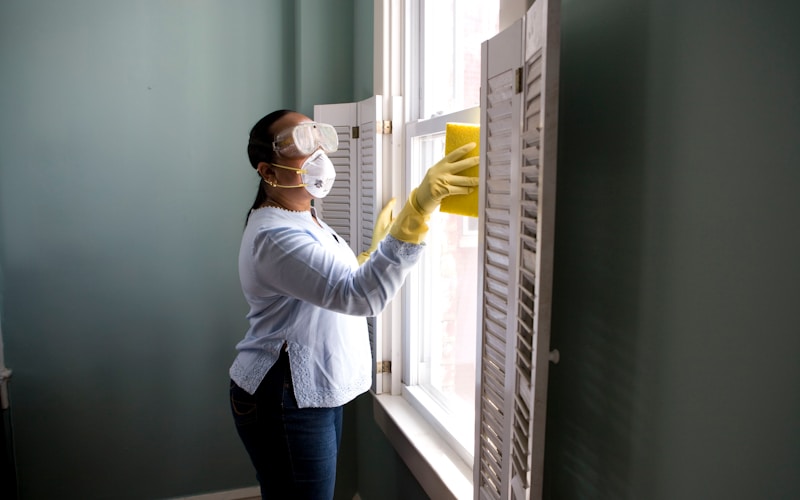 Caregiver doing light housekeeping in a senior client’s home in Maitland, Central Florida